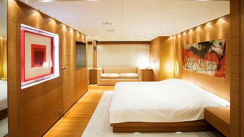 a room with a bed and a couch aboard QUEEN BLUE Yacht for Sale