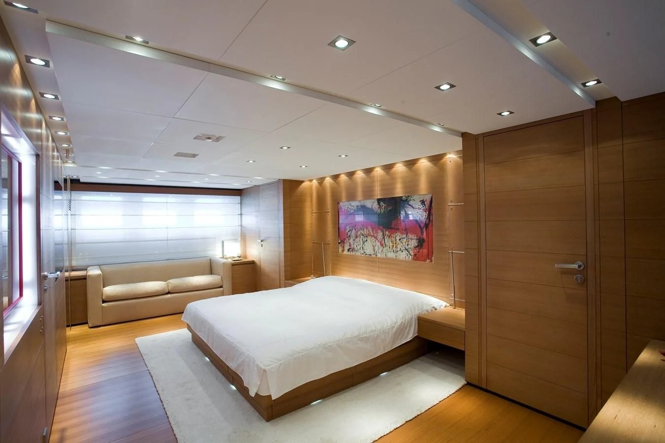 a room with a bed and a wood cabinet aboard QUEEN BLUE Yacht for Sale
