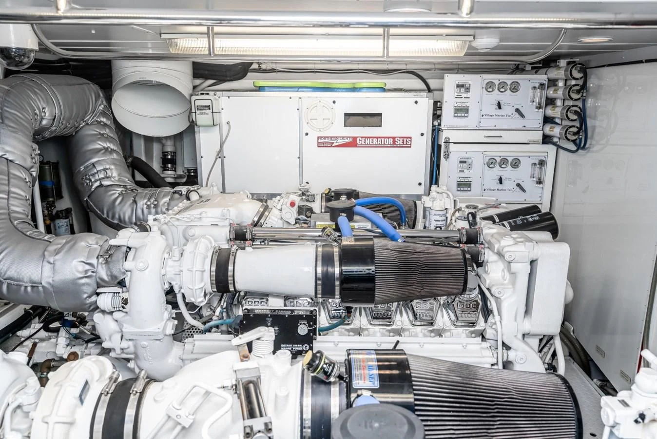 a car with a large engine aboard MAHANA Yacht for Sale