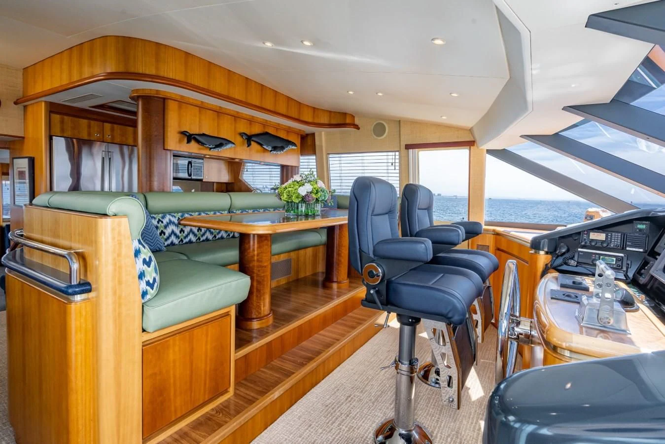 a room with a piano and a chair aboard MAHANA Yacht for Sale