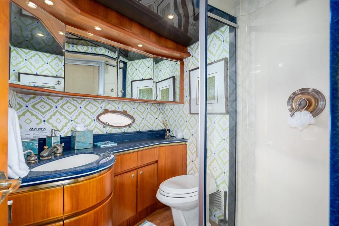 a bathroom with a large mirror aboard MAHANA Yacht for Sale