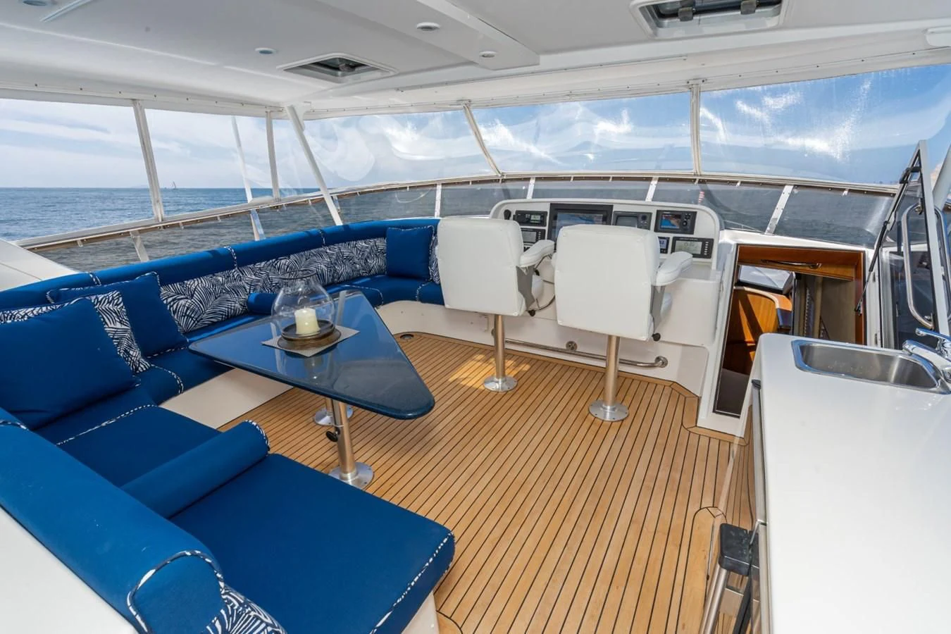 a boat with a table and chairs aboard MAHANA Yacht for Sale