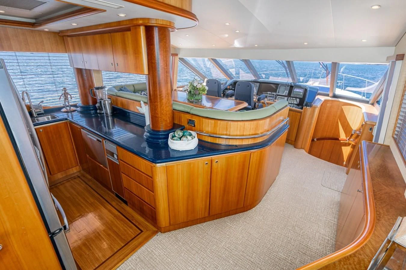 a large kitchen with a large island aboard MAHANA Yacht for Sale