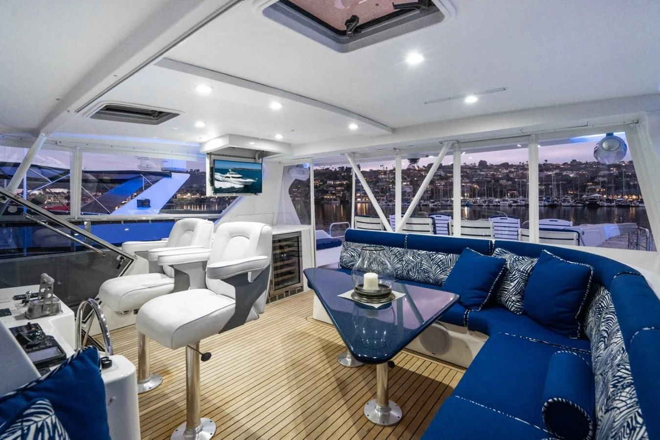 a room with a table and chairs aboard MAHANA Yacht for Sale