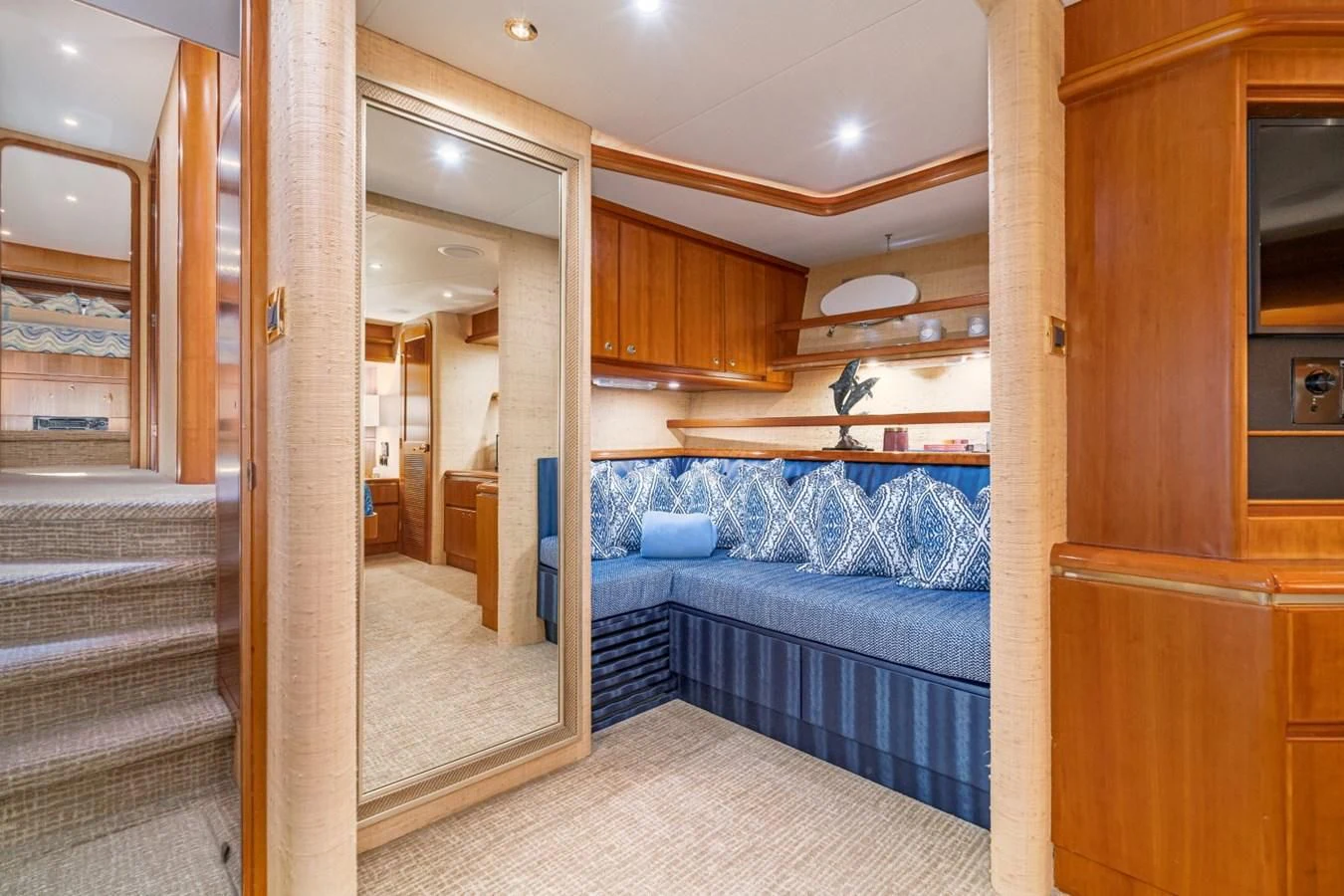 a bedroom with a bed and a closet aboard MAHANA Yacht for Sale