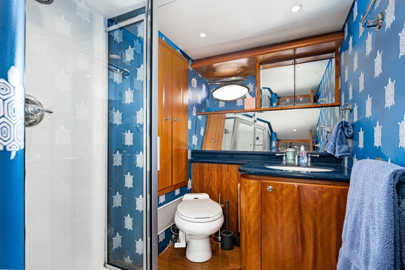 a bathroom with a toilet and a sink aboard MAHANA Yacht for Sale