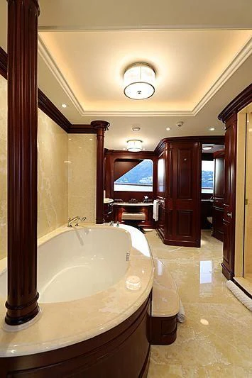 a bathroom with a bathtub and sink aboard PREDICTION Yacht for Sale