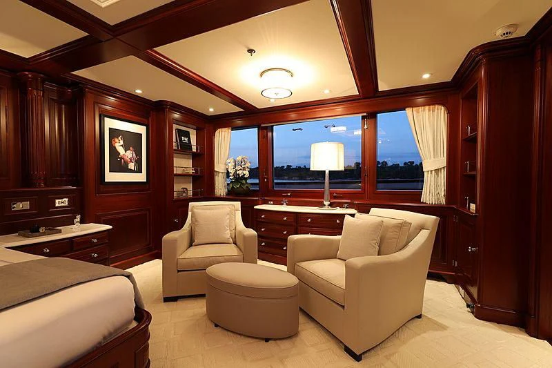 a room with a bed and a desk aboard PREDICTION Yacht for Sale