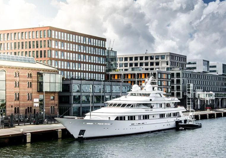 a boat docked at a pier aboard PREDICTION Yacht for Sale