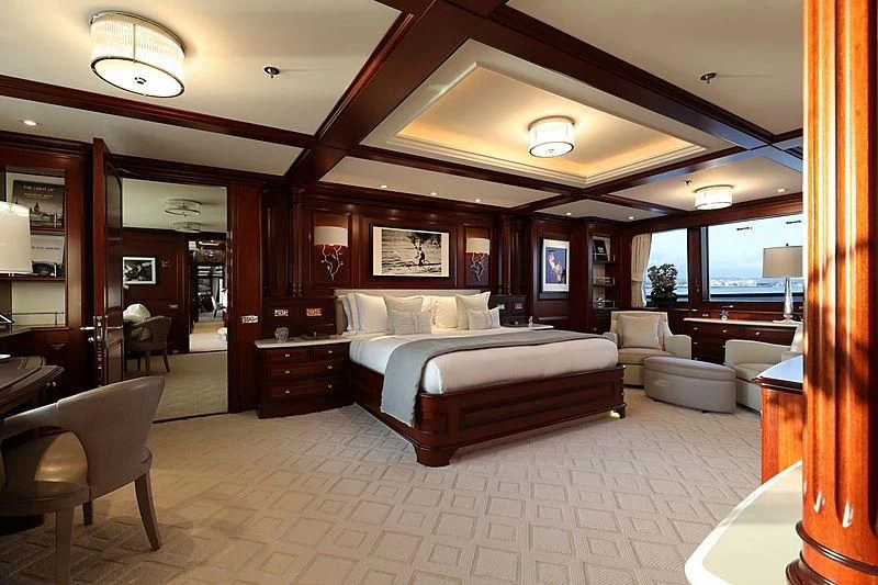 a large bedroom with a bed aboard PREDICTION Yacht for Sale