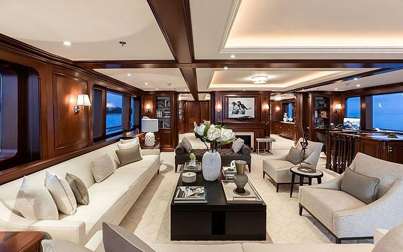 a living room with a large window aboard PREDICTION Yacht for Sale