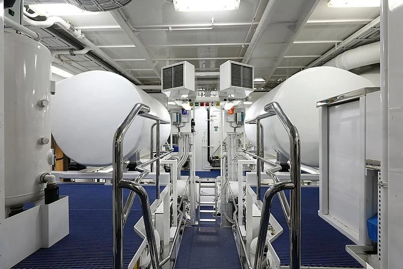 a room with several rows of white machines aboard PREDICTION Yacht for Sale