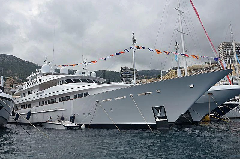 a large white boat in the water aboard PREDICTION Yacht for Sale