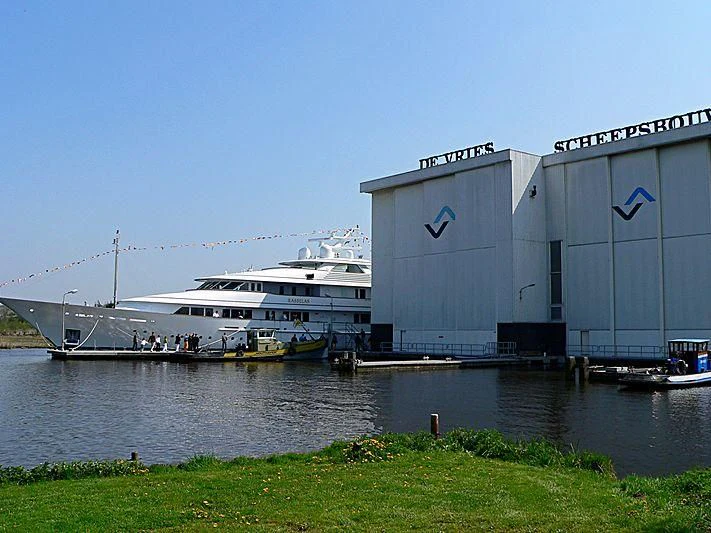 a large white ship docked aboard PREDICTION Yacht for Sale