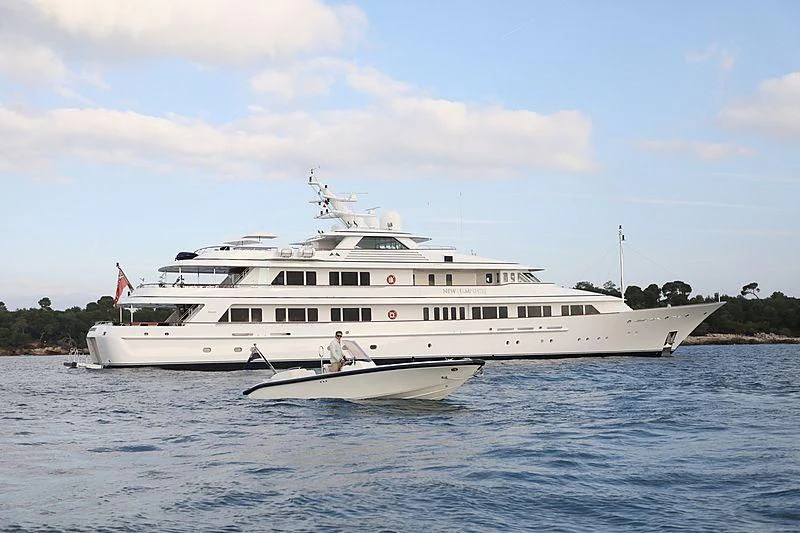 a white boat on the water aboard PREDICTION Yacht for Sale