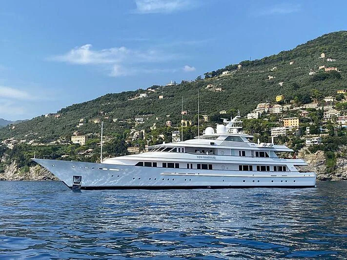 a large white boat in the water aboard PREDICTION Yacht for Sale