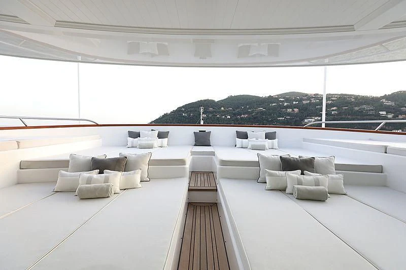 a large white room with a large window and a view of a city aboard PREDICTION Yacht for Sale