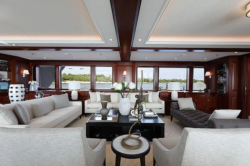 a living room with a large window aboard PREDICTION Yacht for Sale