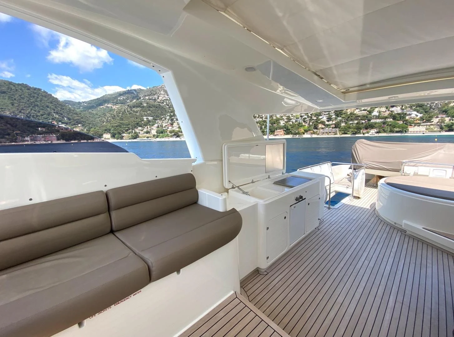 a room with a couch and a television aboard MELI Yacht for Charter