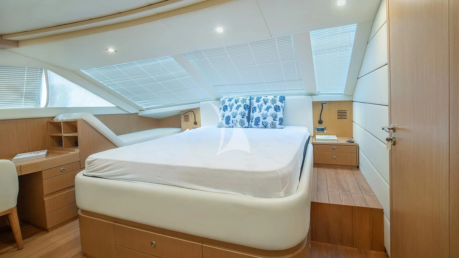 a large white bed in a room aboard MELI Yacht for Charter