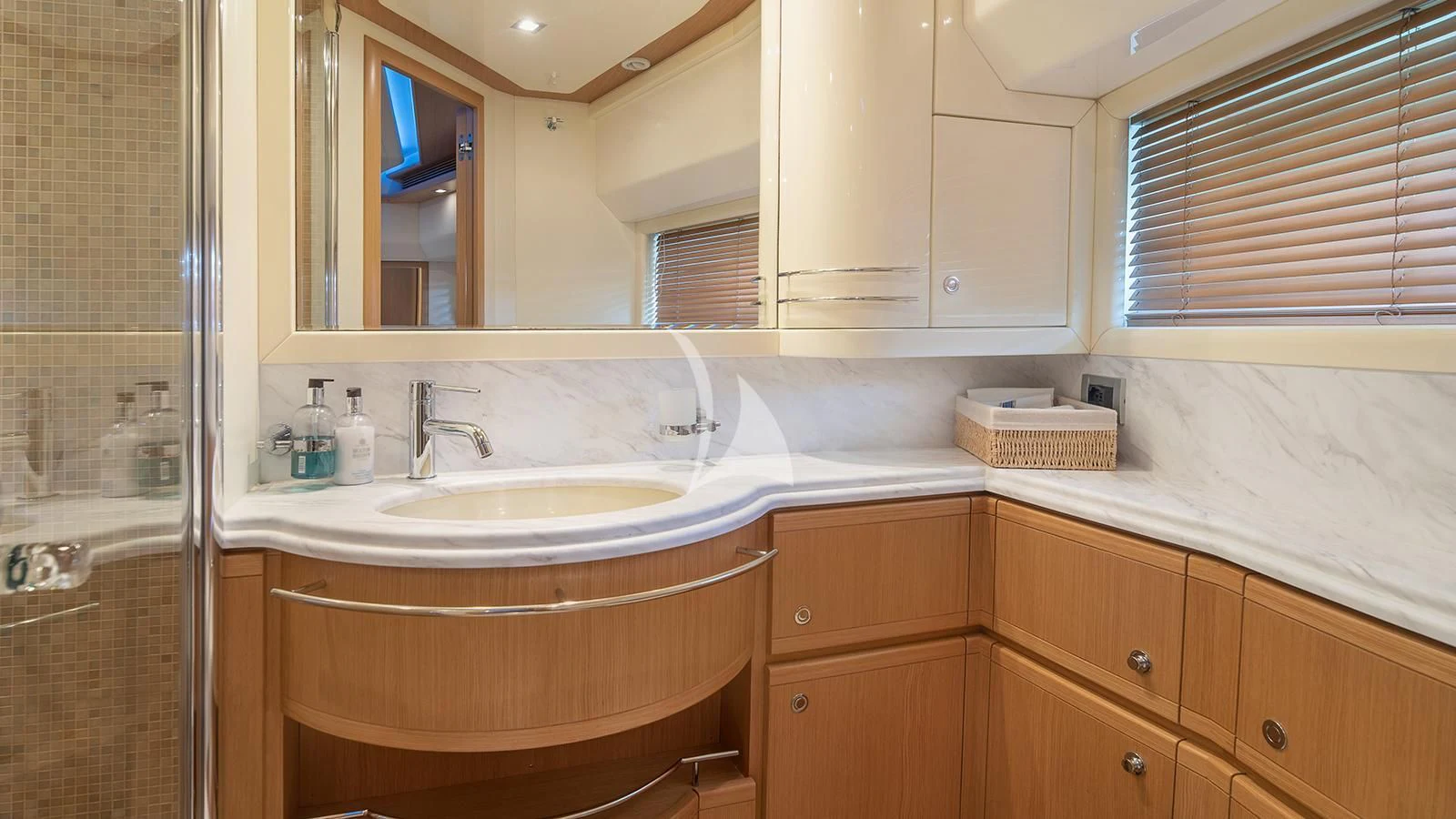 a bathroom with a sink and a mirror aboard MELI Yacht for Charter