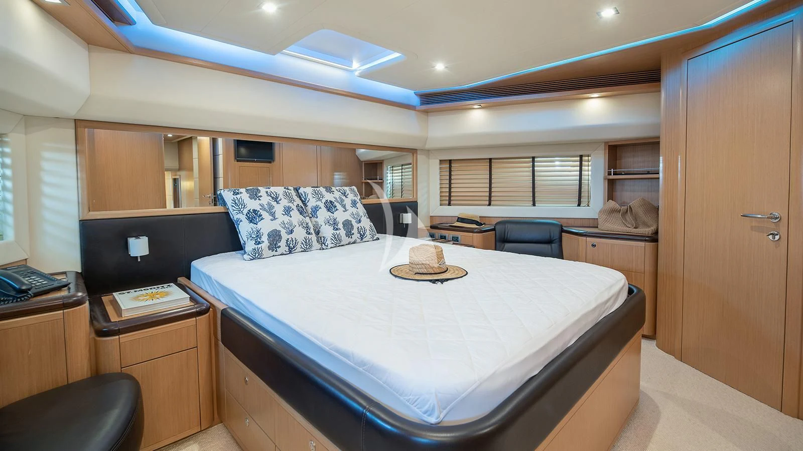 a large bed in a room aboard MELI Yacht for Charter