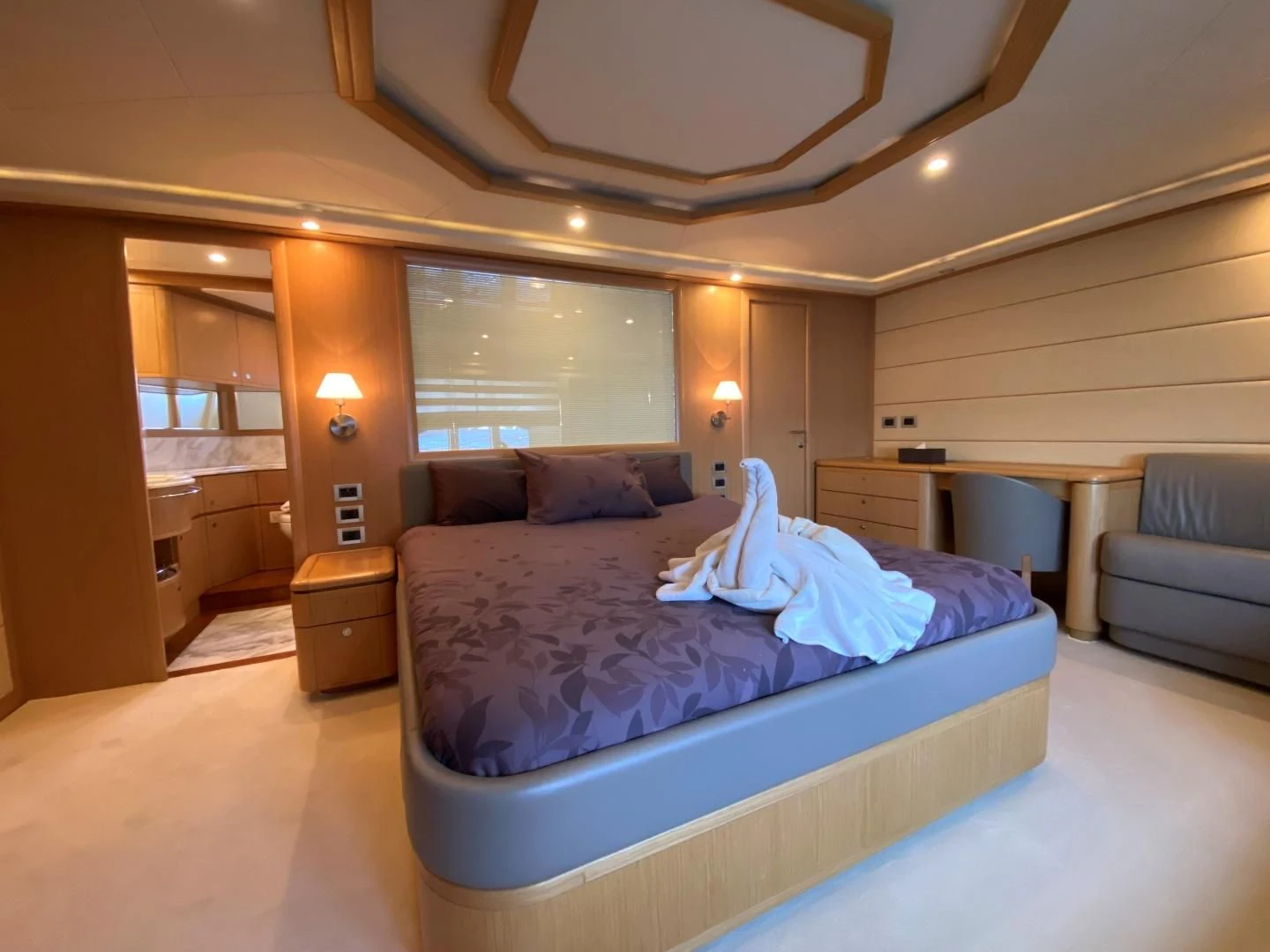 a room with a bed and a couch aboard MELI Yacht for Charter