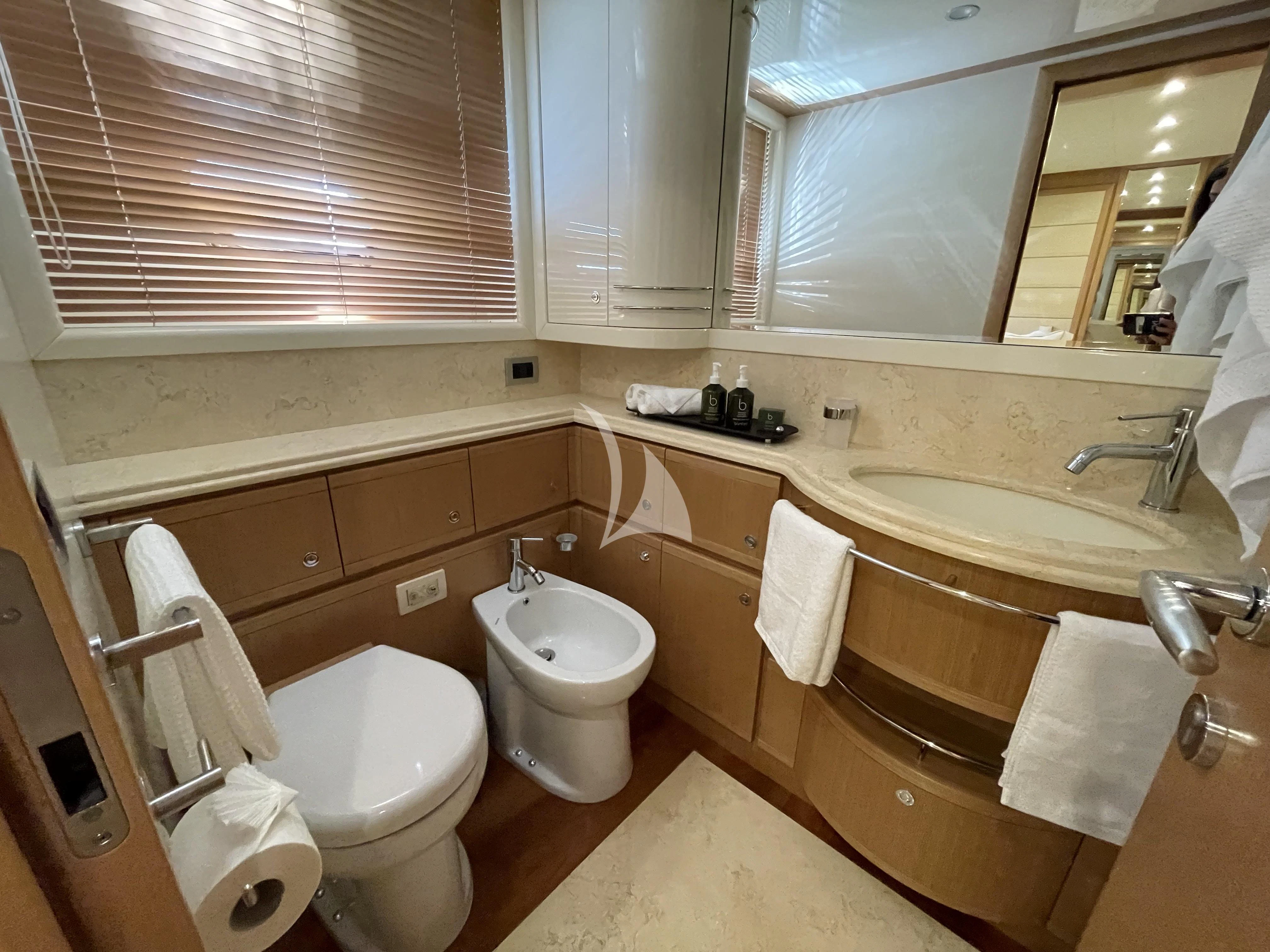 a bathroom with a toilet and sink aboard MELI Yacht for Charter