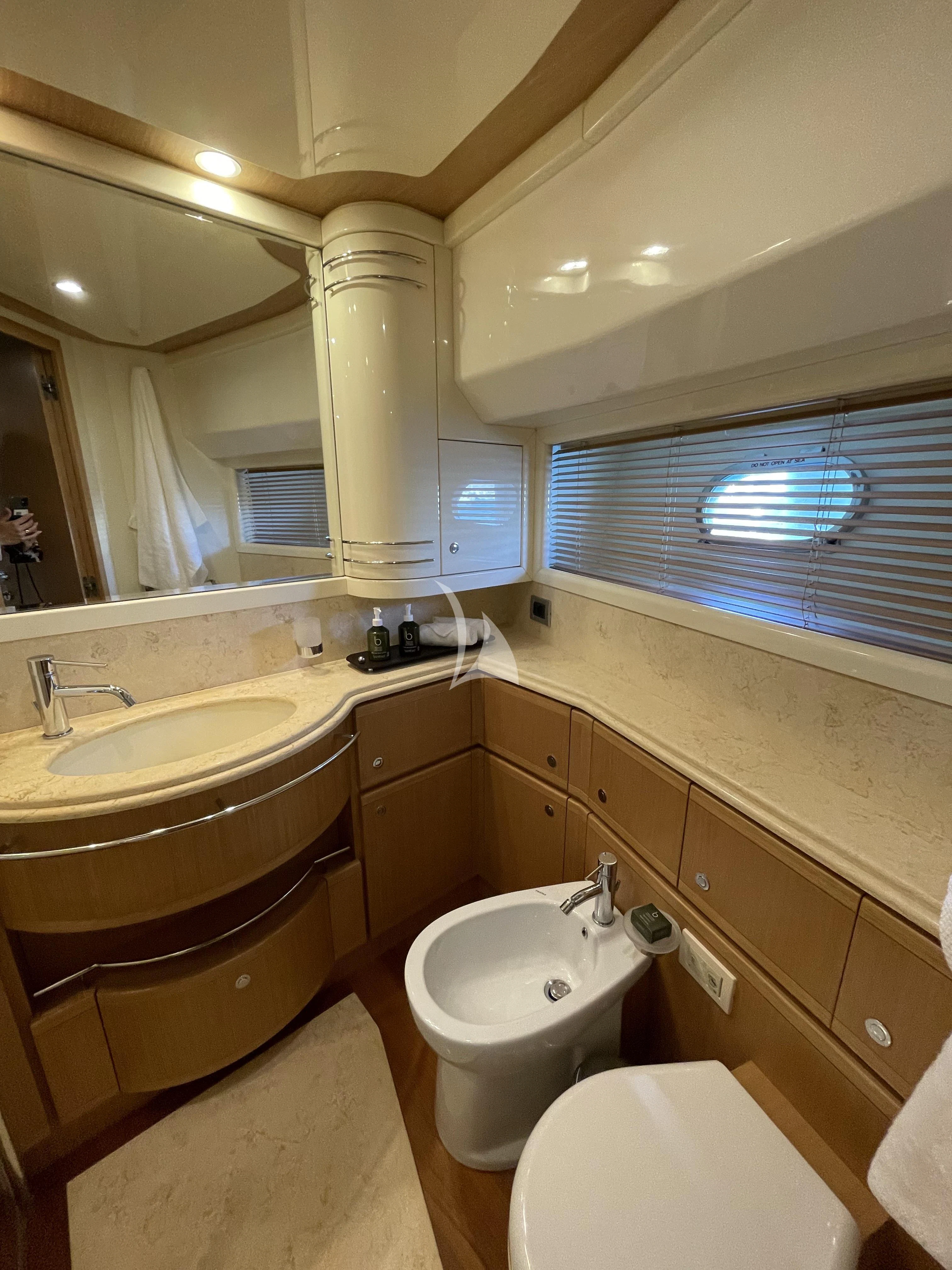 a bathroom with a toilet and sink aboard MELI Yacht for Charter