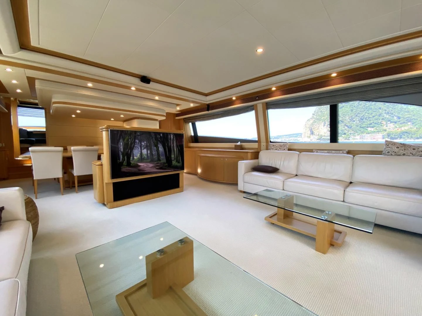 a living room with a large television aboard MELI Yacht for Charter