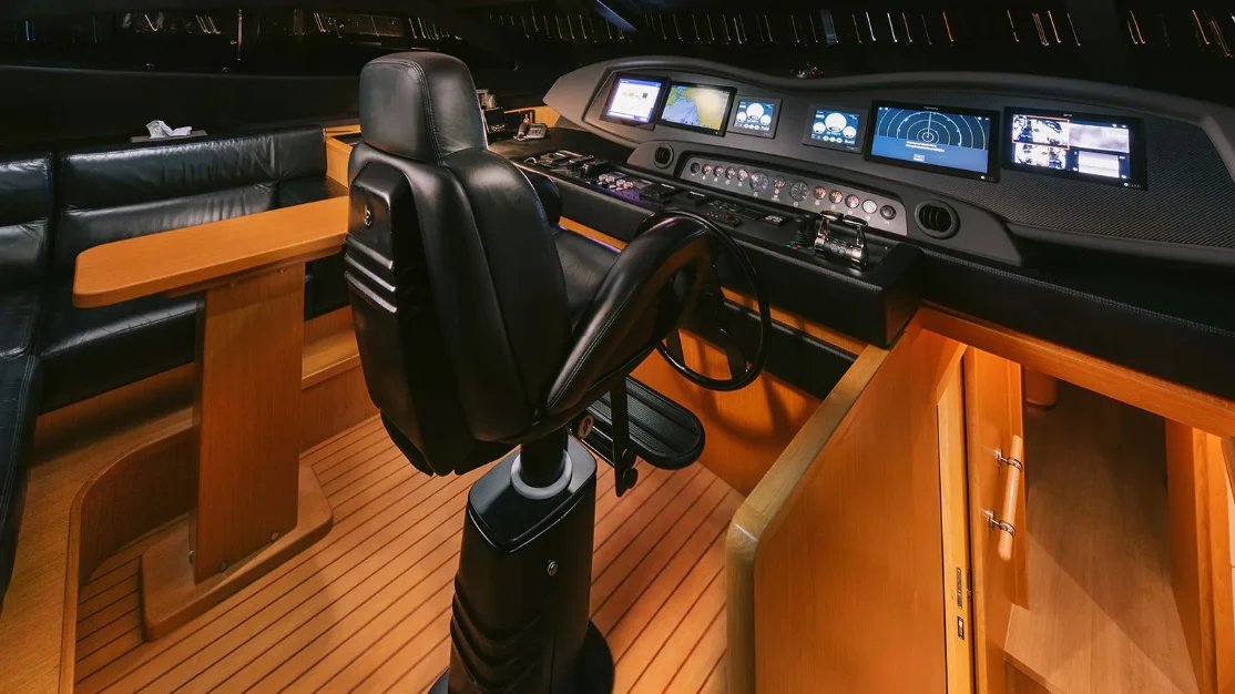 a black chair in a control room aboard MELI Yacht for Charter