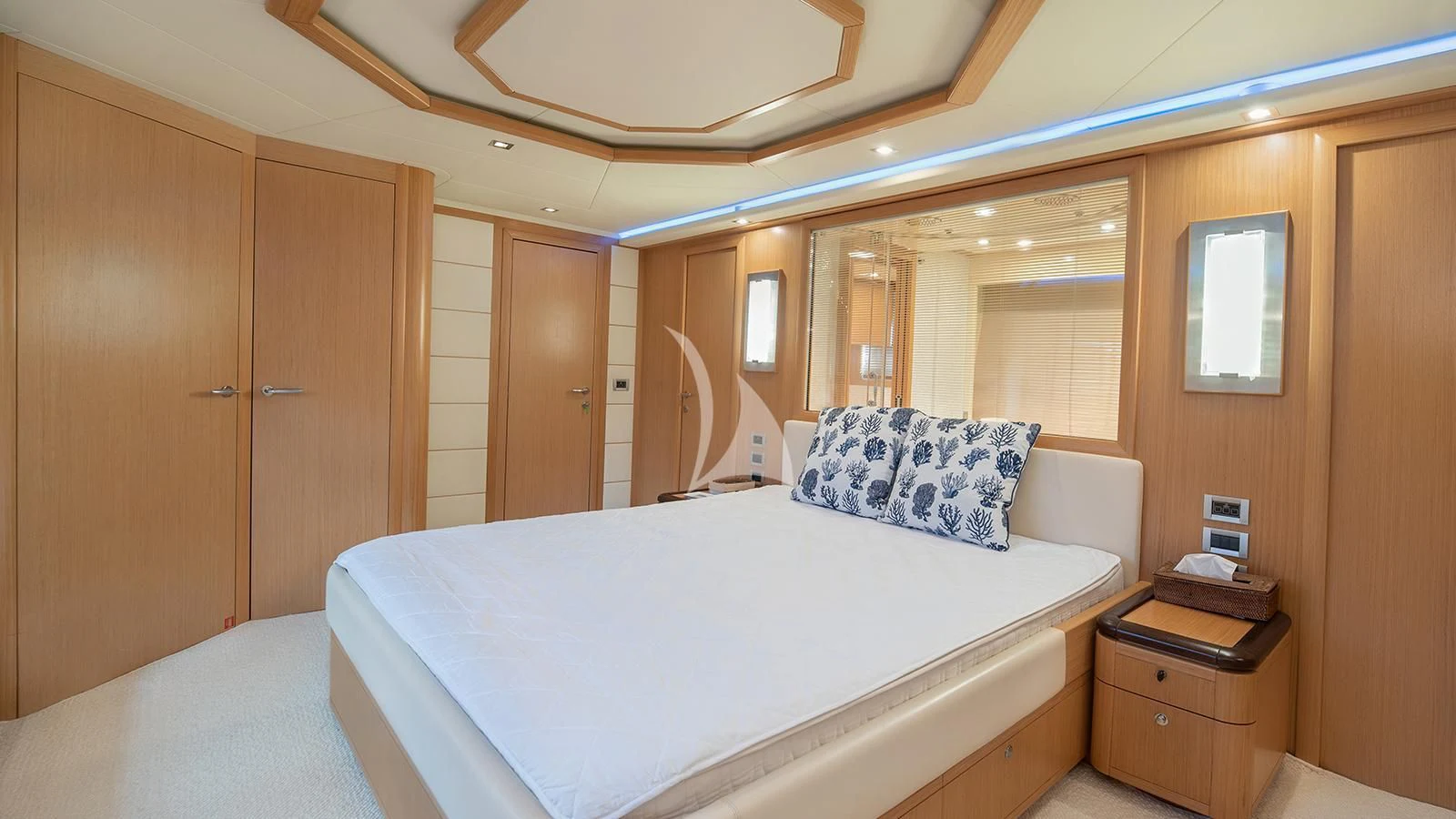 a hotel room with a bed aboard MELI Yacht for Charter