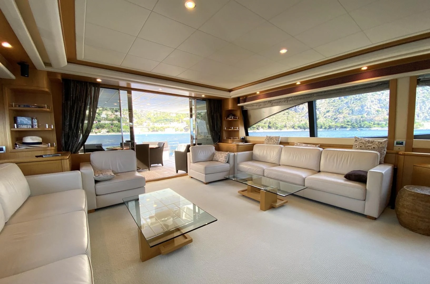 a living room with a large window aboard MELI Yacht for Charter