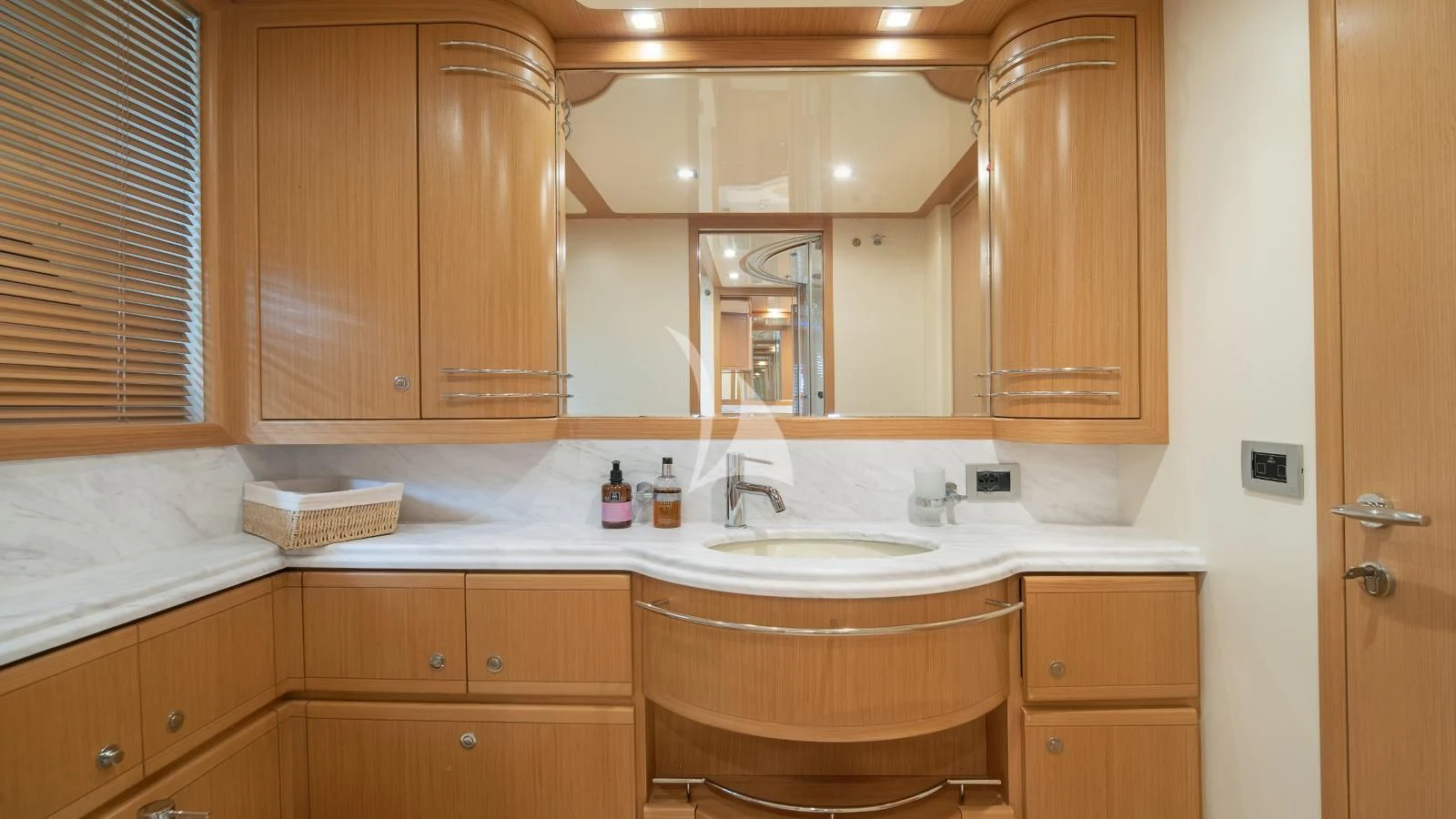 a bathroom with wooden cabinets aboard MELI Yacht for Charter