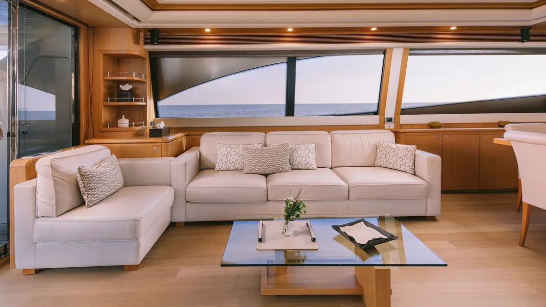 a living room with a large window aboard MELI Yacht for Charter
