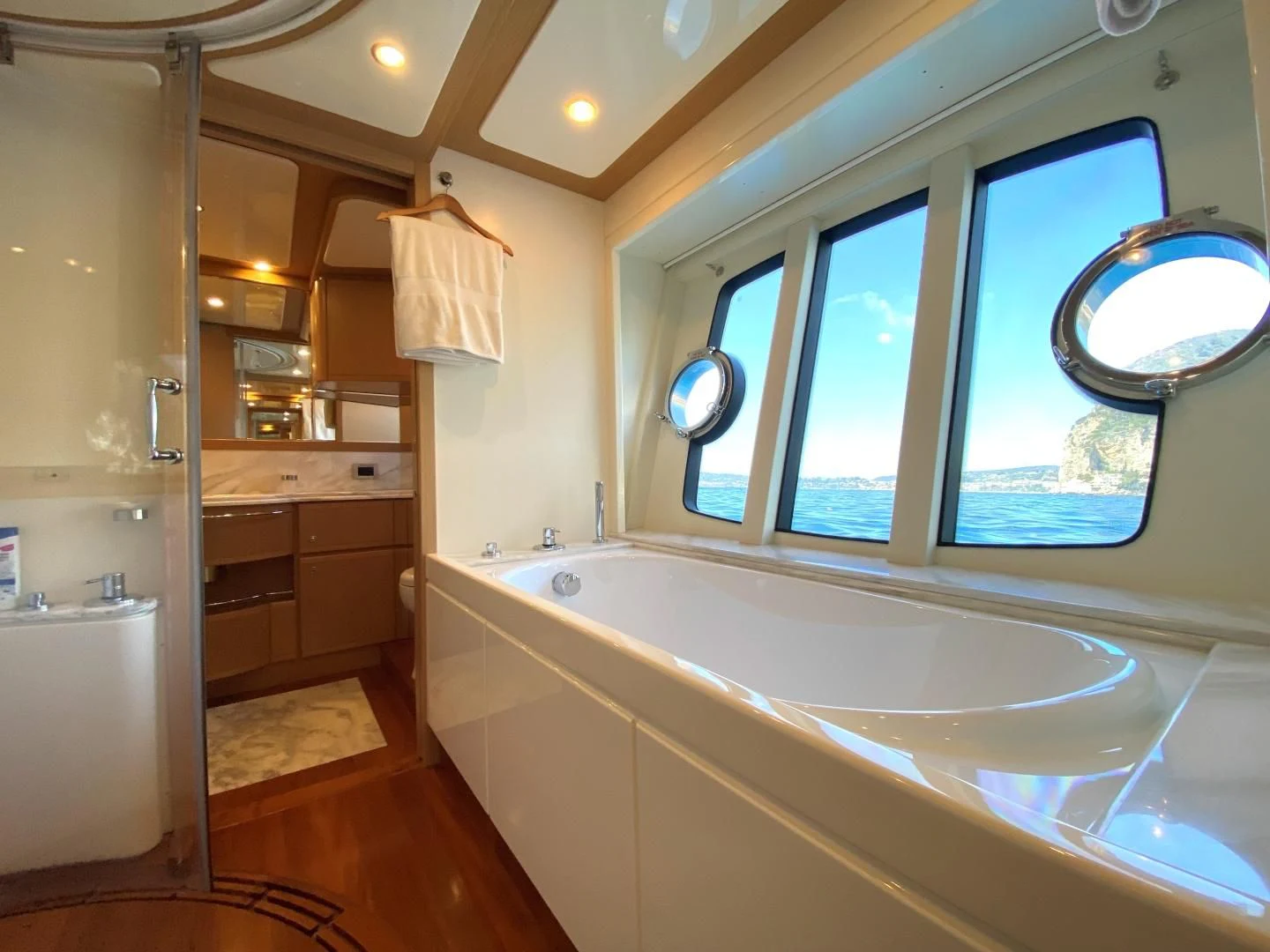 a bathroom with a tub and a sink aboard MELI Yacht for Charter