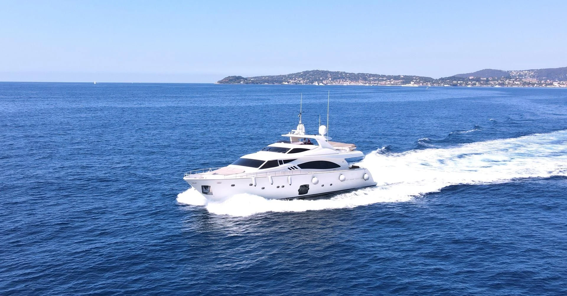 a white yacht on the water aboard MELI Yacht for Charter