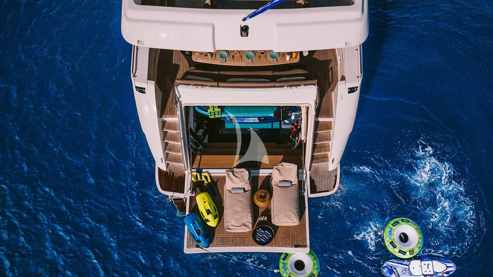 a toy car on a blue surface aboard MELI Yacht for Charter