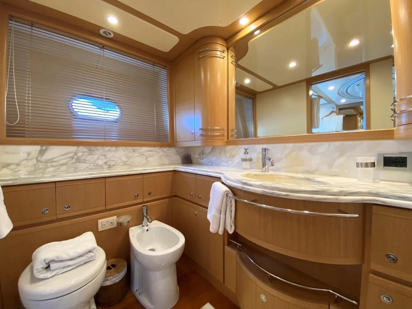 a bathroom with a toilet and a sink aboard MELI Yacht for Charter