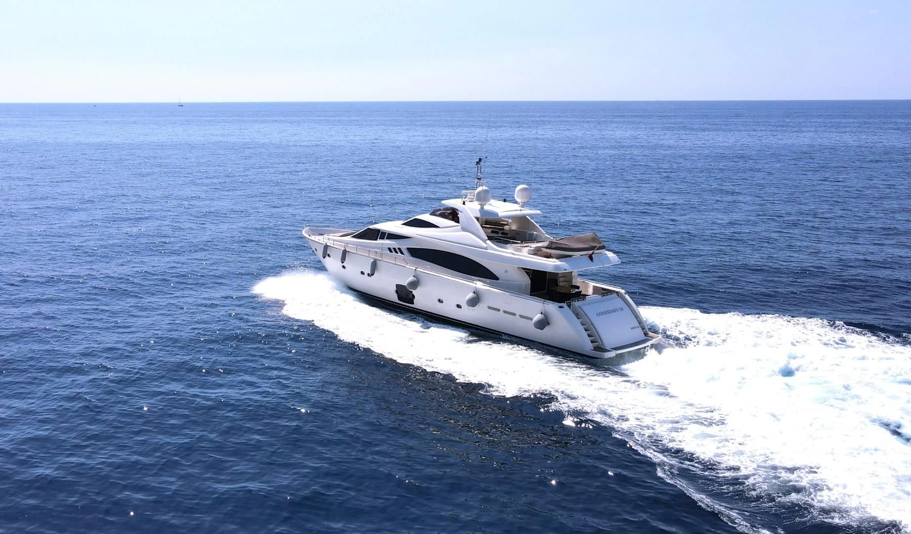 a white yacht on the water aboard MELI Yacht for Charter