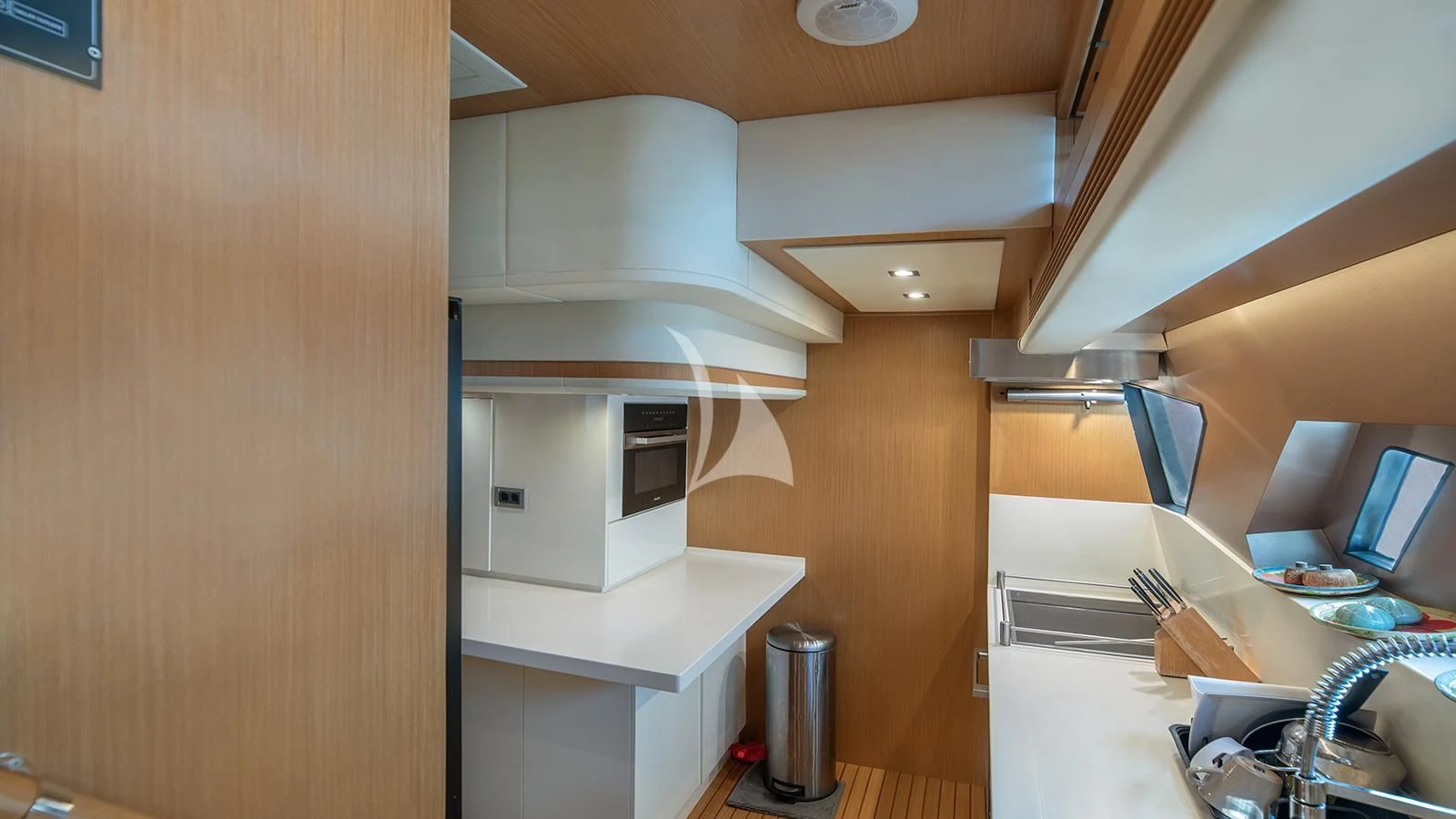 a kitchen with a sink and cabinets aboard MELI Yacht for Charter