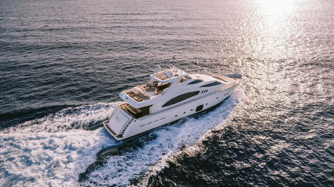 a white boat in the water aboard MELI Yacht for Charter