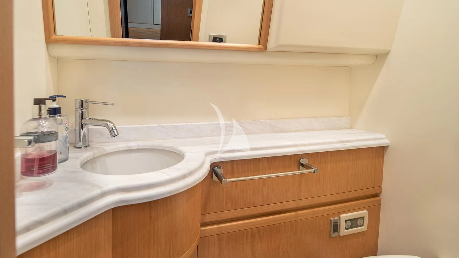 a bathroom sink with a mirror above it aboard MELI Yacht for Charter