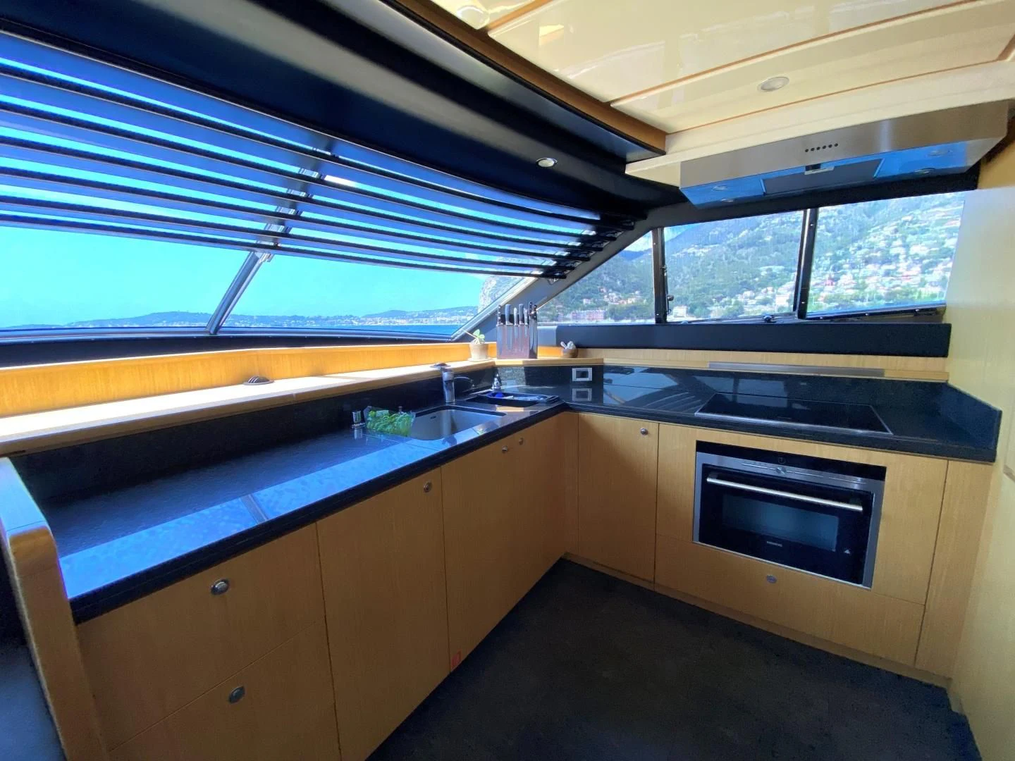 a kitchen with a large window aboard MELI Yacht for Charter