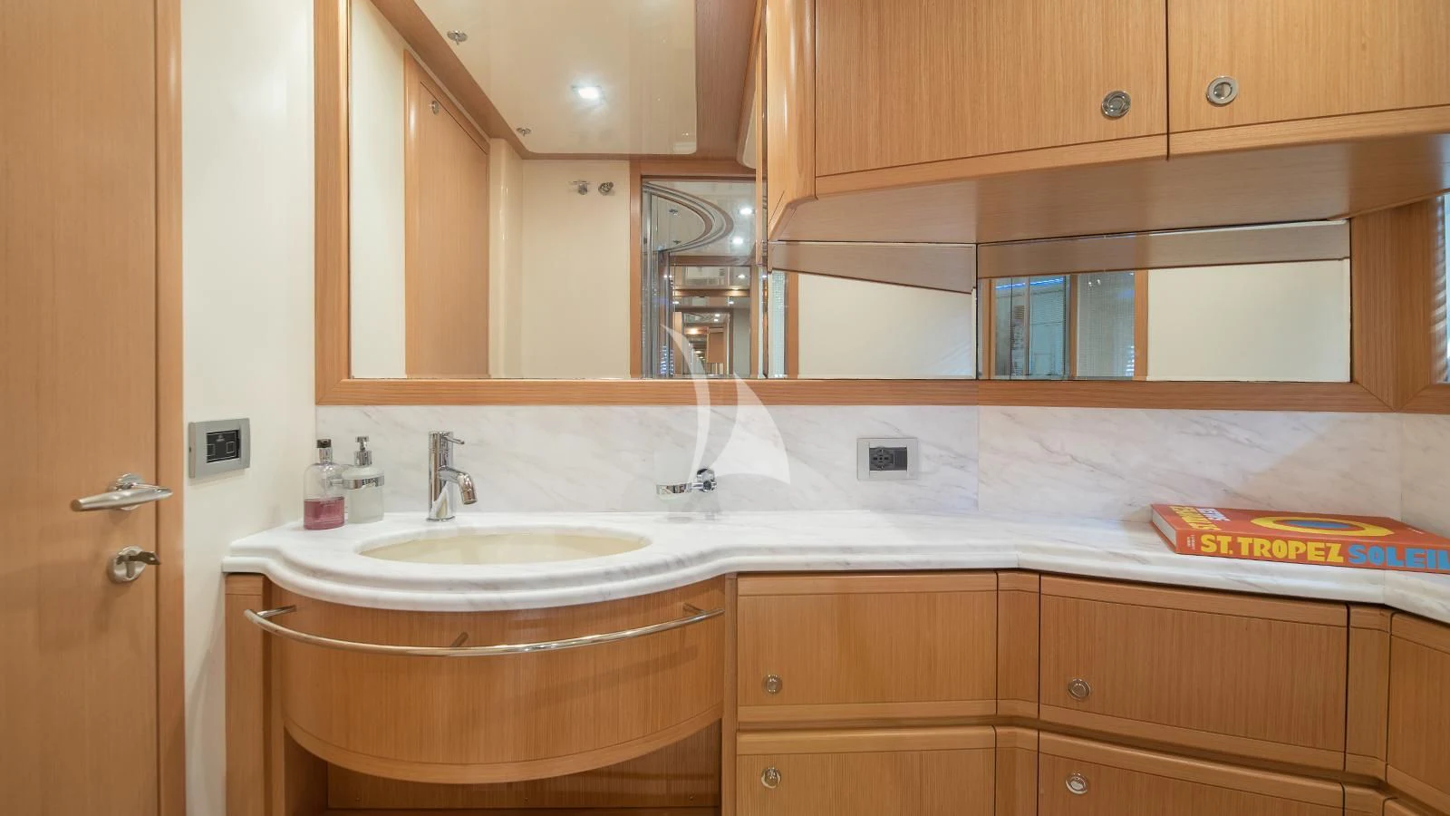 a bathroom with a sink and a mirror aboard MELI Yacht for Charter