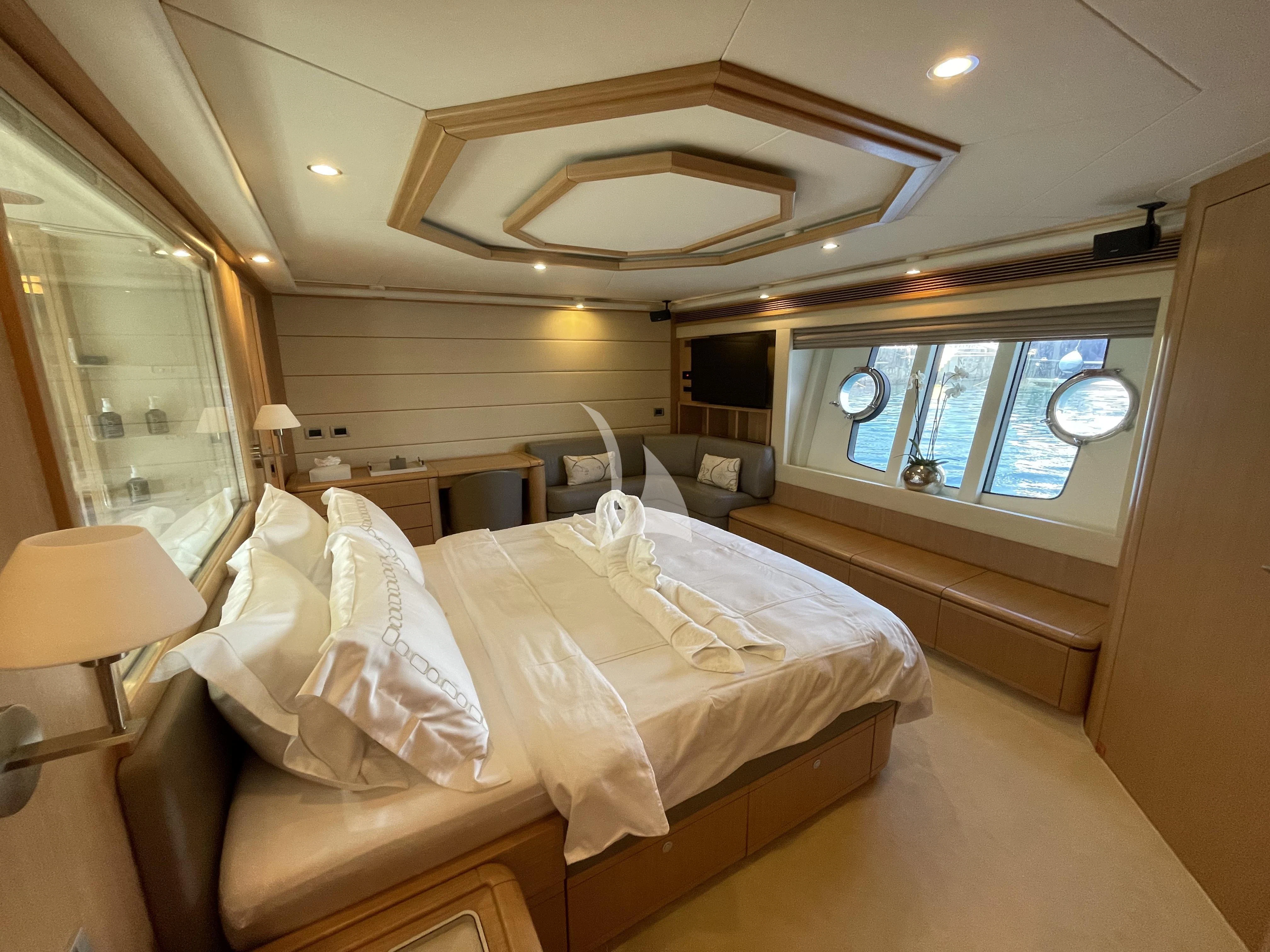 a room with a bed and a window aboard MELI Yacht for Charter