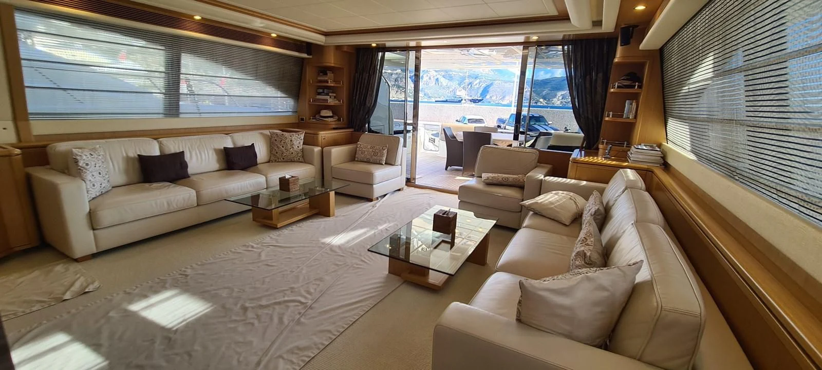 a living room with a couch and a coffee table aboard MELI Yacht for Charter