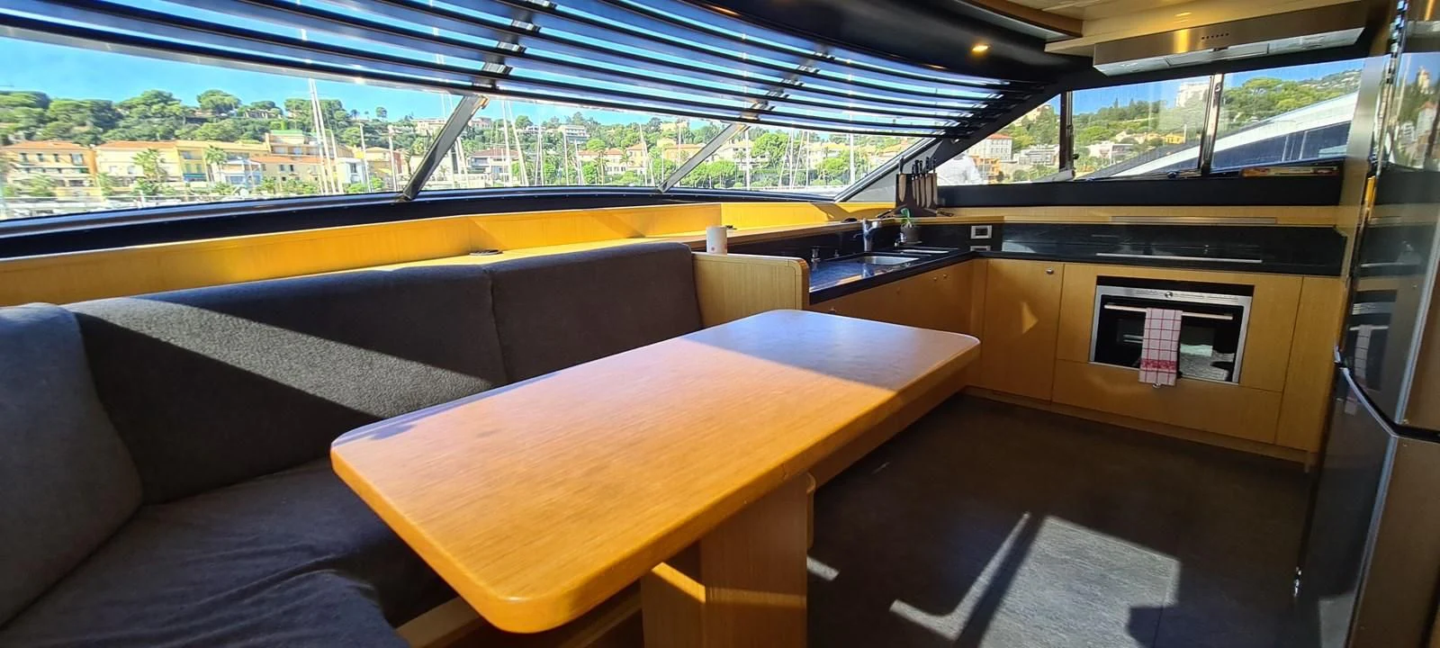 a room with a couch and a table aboard MELI Yacht for Charter