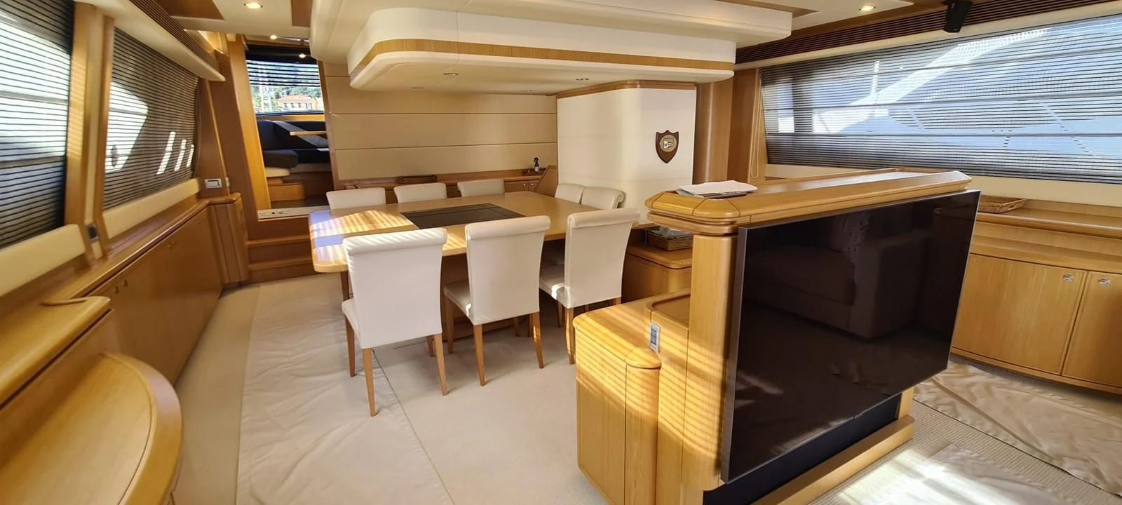 a room with a table and chairs aboard MELI Yacht for Charter
