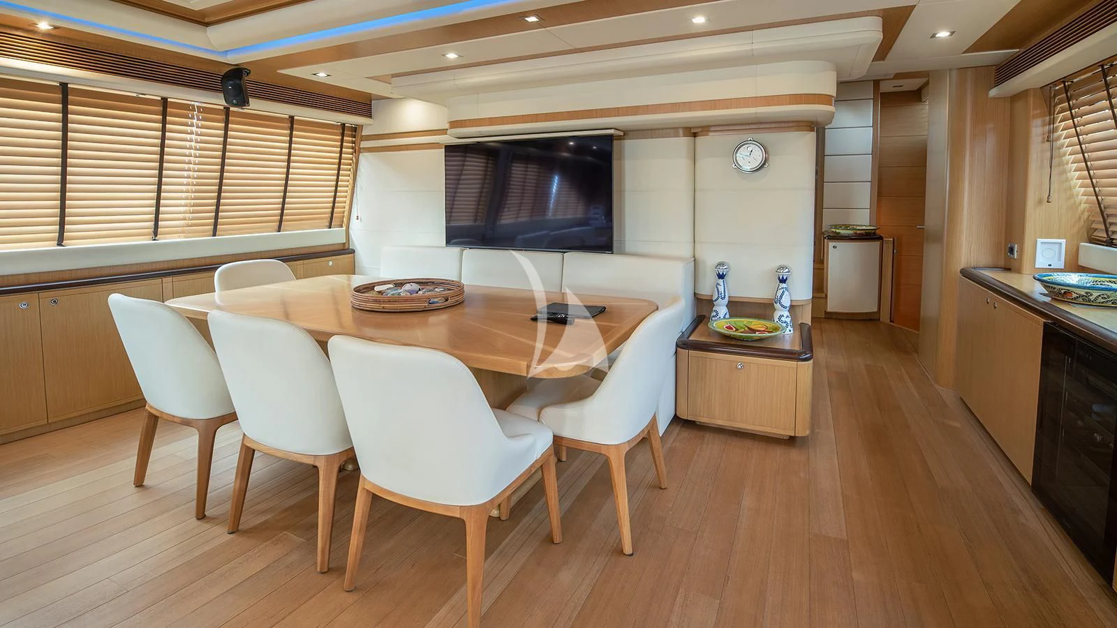 a large kitchen with a table and chairs aboard MELI Yacht for Charter